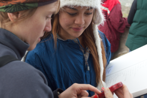 “I want to be that person, even for one day only, who makes ‘science’ and ‘adventure’ make sense in the same sentence for kids.” UA doctoral candidate Pacifica Sommers teaches students about science during the Sky School program. (Photo by Ben Blonder/UA Science: Sky School)